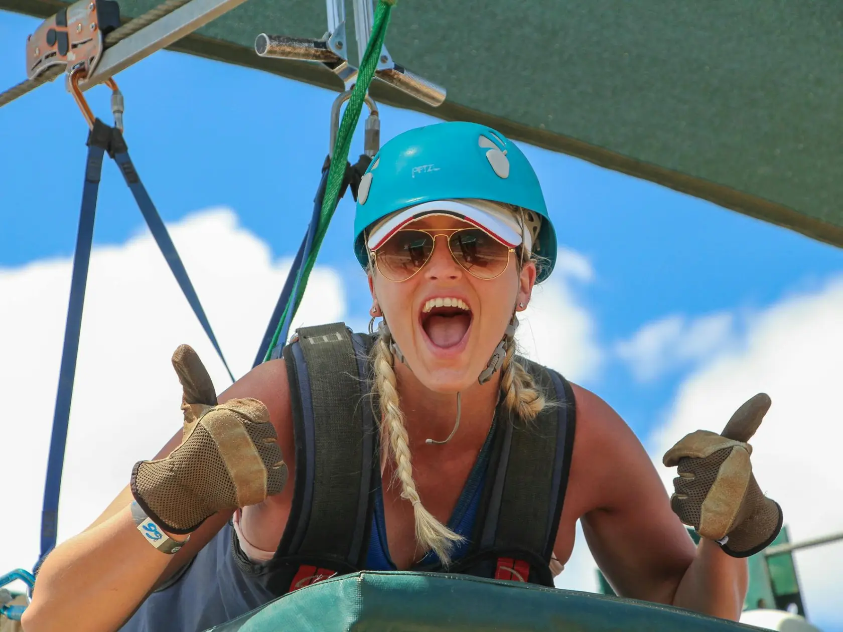 a woman wearing a hat and sunglasses