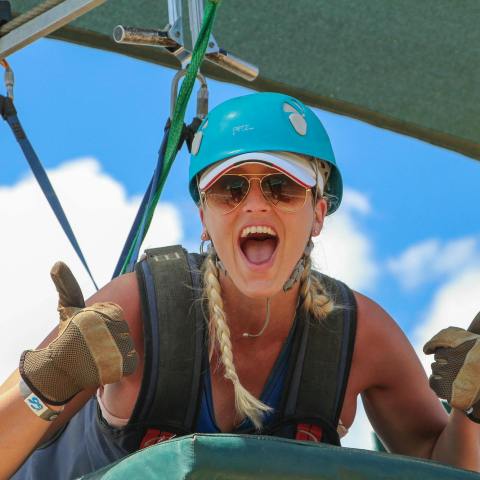 a woman wearing a hat and sunglasses