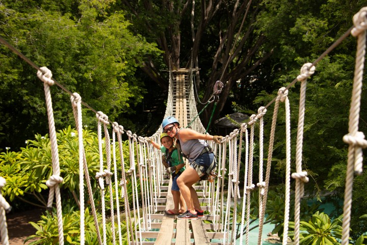 Two people on a hanging bridge