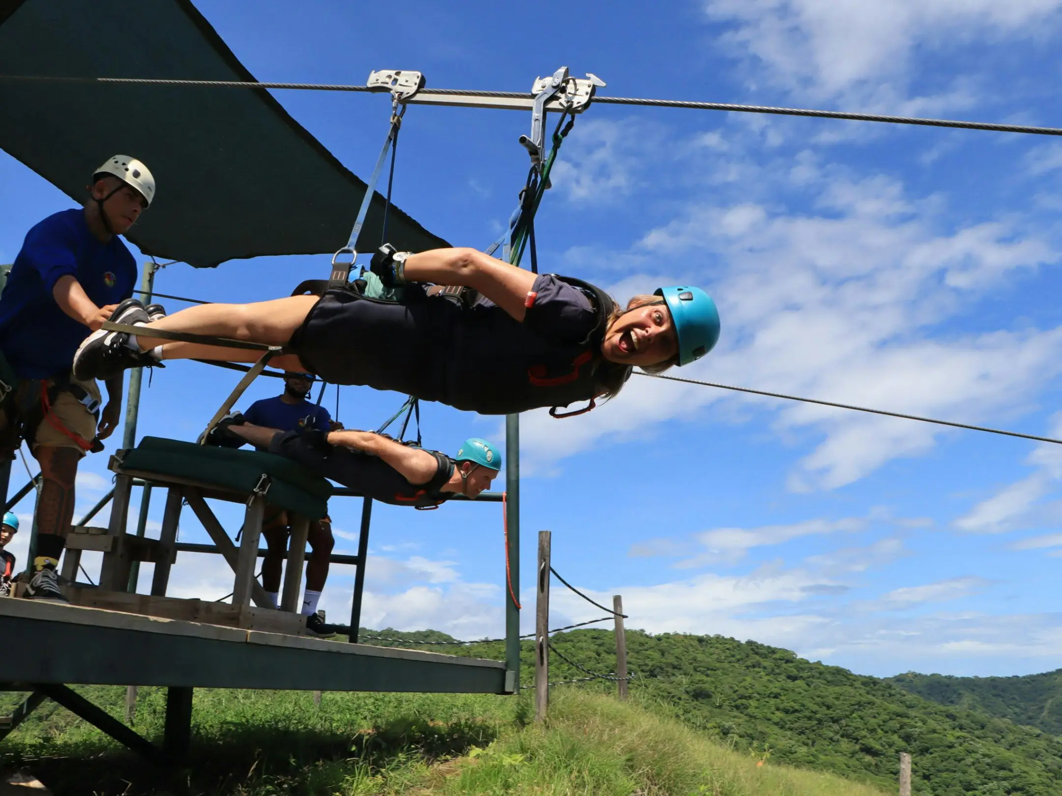 a couple of people that are standing in the grass