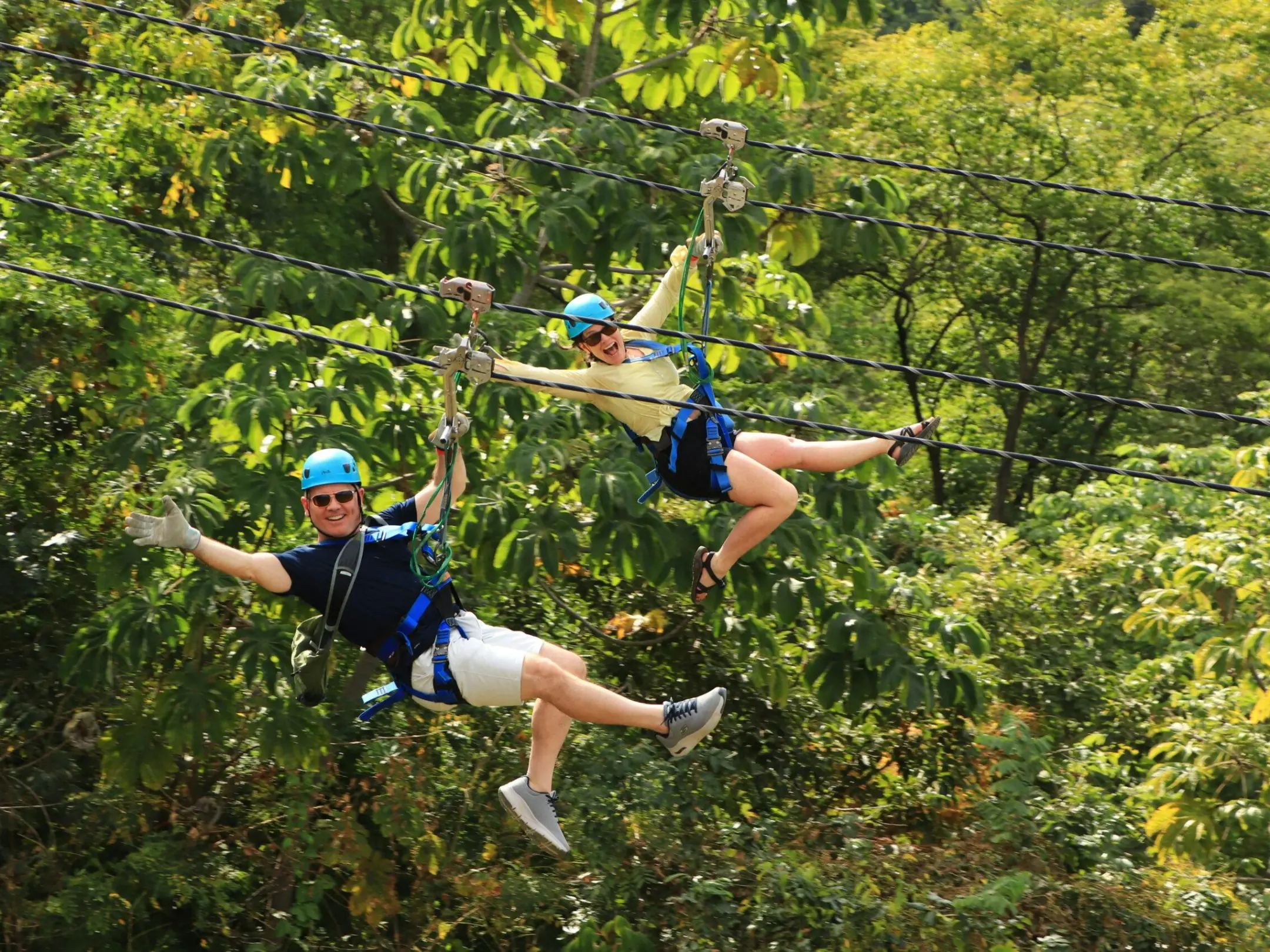 a group of people playing frisbee in a park