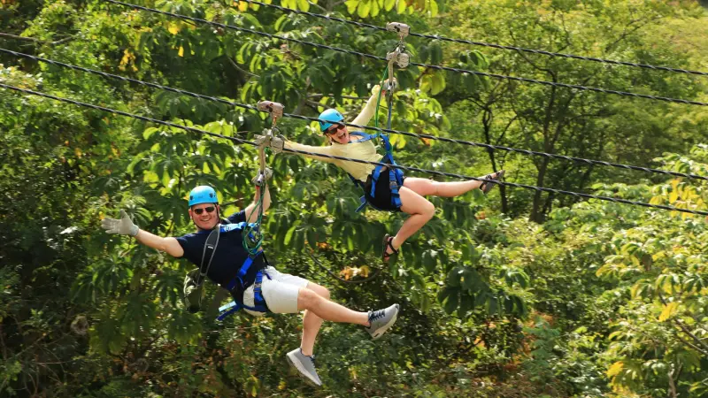 a group of people playing frisbee in a park
