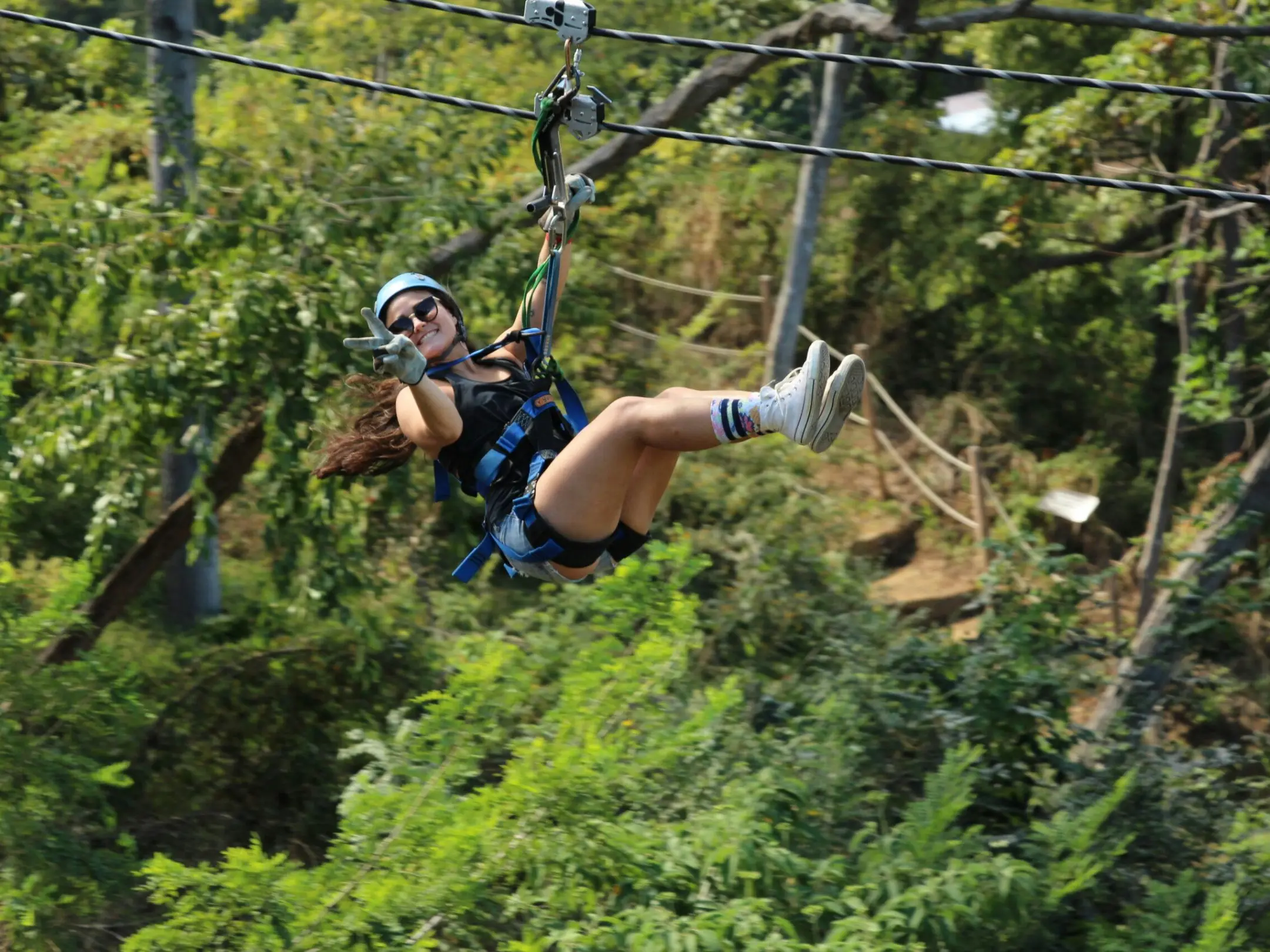 a man riding a bike down a dirt road
