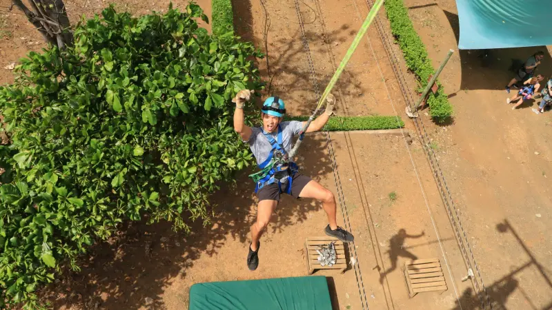a man walking down a dirt road