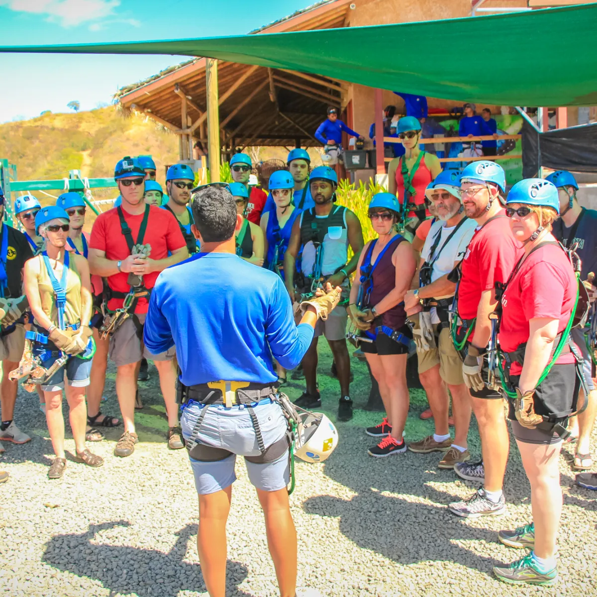 A group of visitors getting a safety lesson