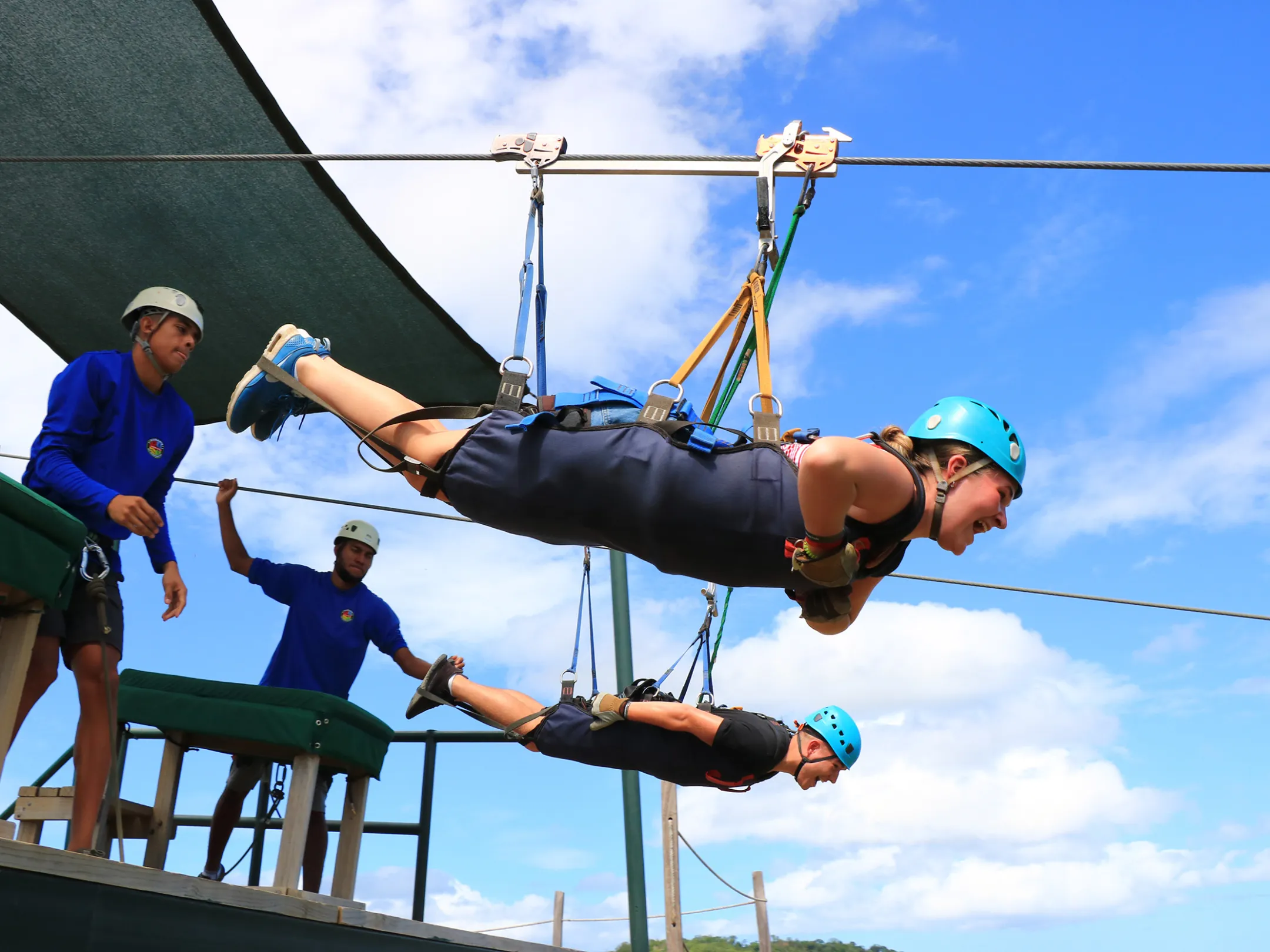 A woman getting ready to begin her zipline adventure