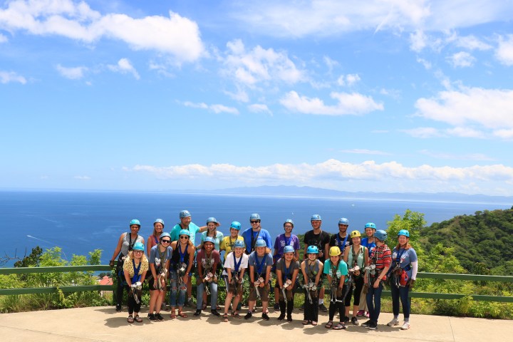 A group getting ready for the superman zipline