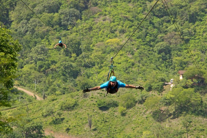 A person soaring over the jungle