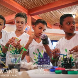 children doing art with recycled materials