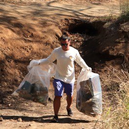 a man that is standing in the dirt