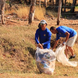 a man that is standing in the dirt