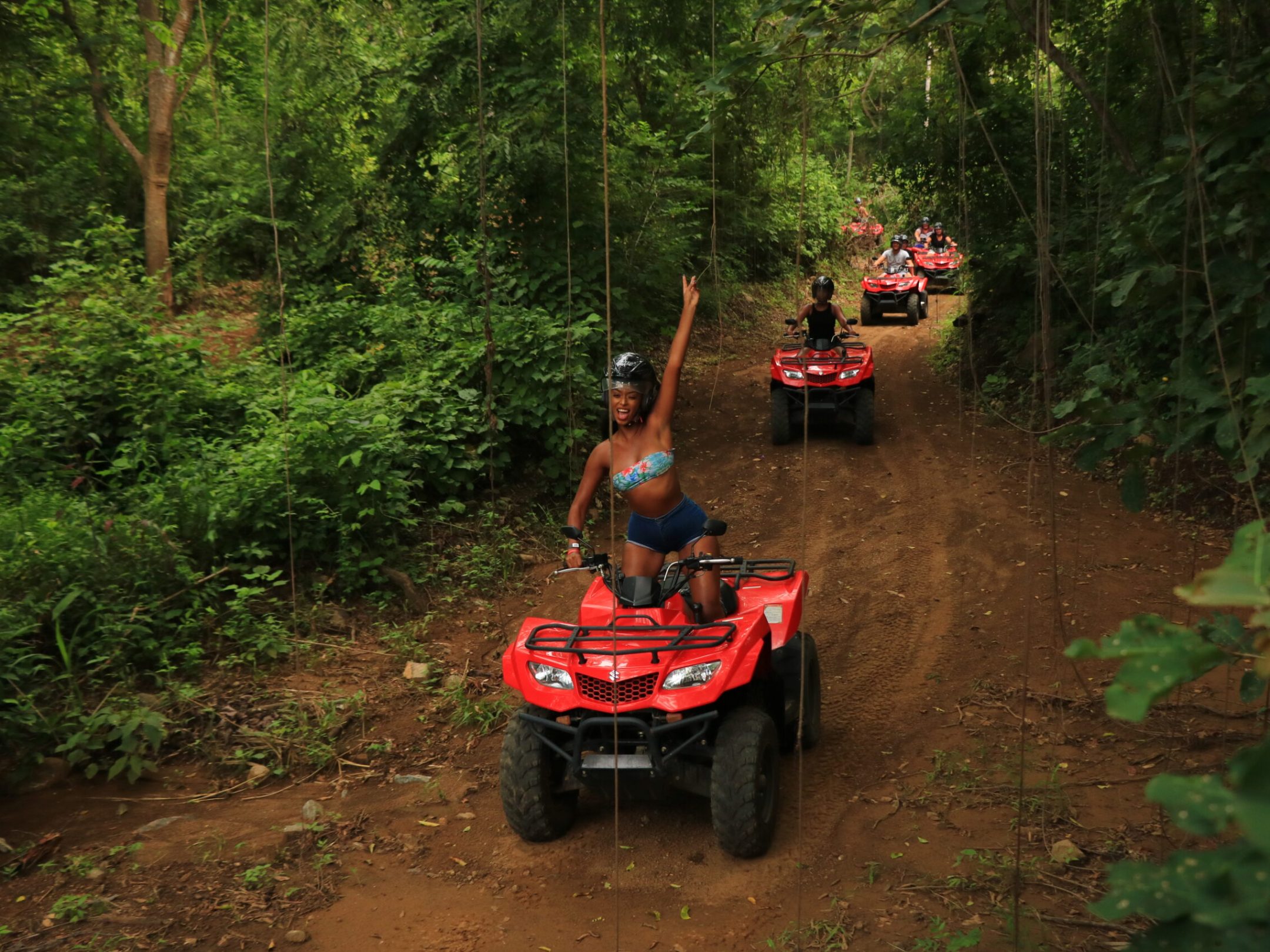 a person riding a bike down a dirt road