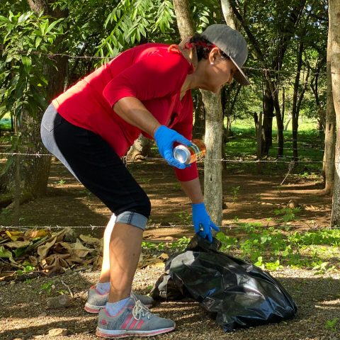 a person standing next to a tree