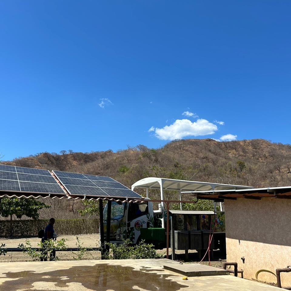 a building with a mountain in the background