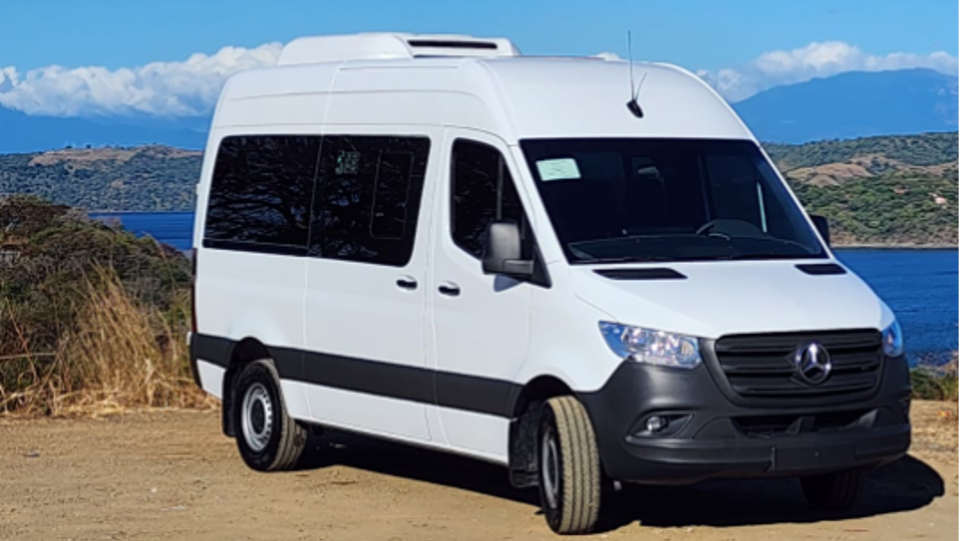a van parked on the side of a mountain