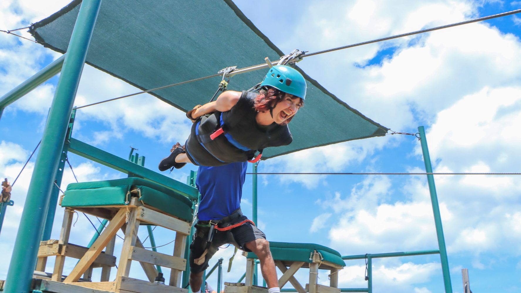 Guest preparing to ride the ocean-view zipline at Diamante Eco Adventure Park