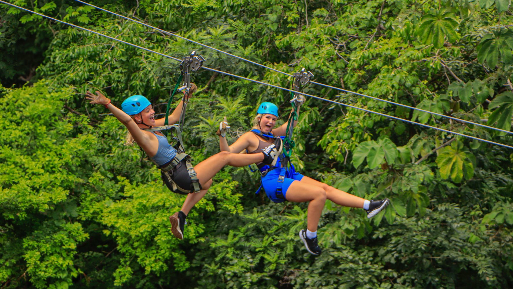 Guests riding side by side on Diamante's dual zipline in Costa Rica